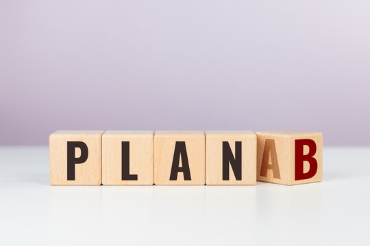 Wooden letter blocks lined up horizontally spelling PLAN A to B, signifying strategic shift, fallback execution and risk mitigation