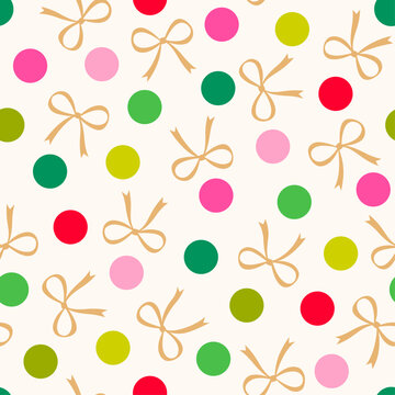 Colorful dot and golden ribbon bow seamless pattern for Christmas and new year holidays background.