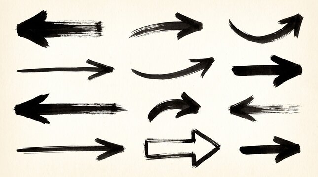 Set of various hand drawn black ink brush stroke arrow icons on a plain textured paper background with design