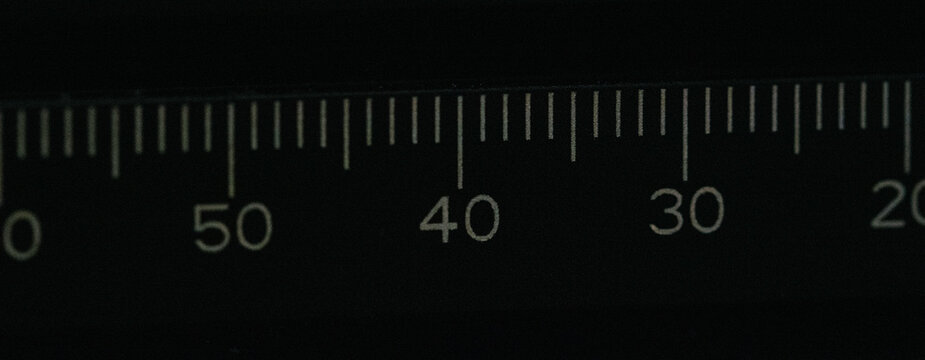 Scientific Ruler with Clear Numerical Marks Displaying Metric Unit Measurements on Black Field