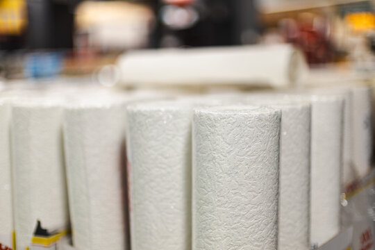 Textured White Wallpaper Rolls in Home Improvement Store