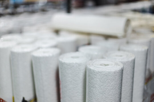 Close-Up of White Toilet Paper Rolls in a Store Display