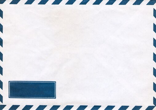 Textured blank airmail envelope shows blue diagonal stripes on its borders, with a rectangular label pattern at the bottom left corner.
