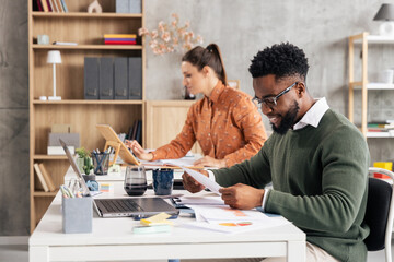 Fototapeta premium Diverse business people working and collaborating in office