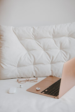 Cozy work-from-home setup with a gold laptop and accessories