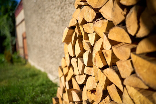 Rustic woodpile in a sunny backyard