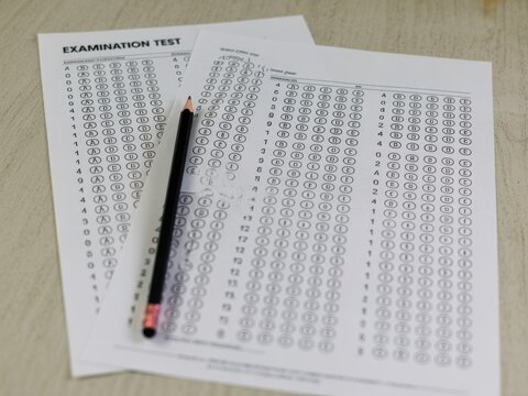 Standardized test paper with a pencil on a desk for academic assessment