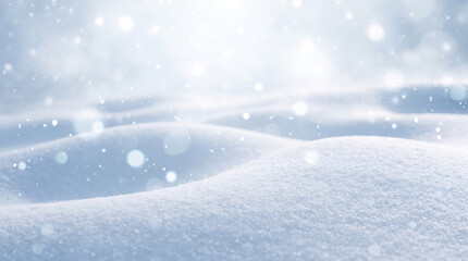 Soft rolling snowdrifts with sparkling snow bokeh particles in peaceful bright winter nature backdrop. © Laura Pashkevich
