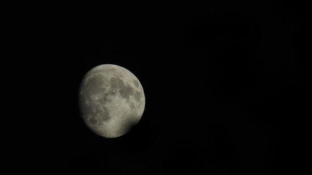 Time lapse sequence showing the moon moving steadily across the night sky