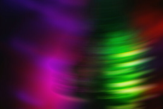 Abstract blurred magenta and green lights represent cyberspace