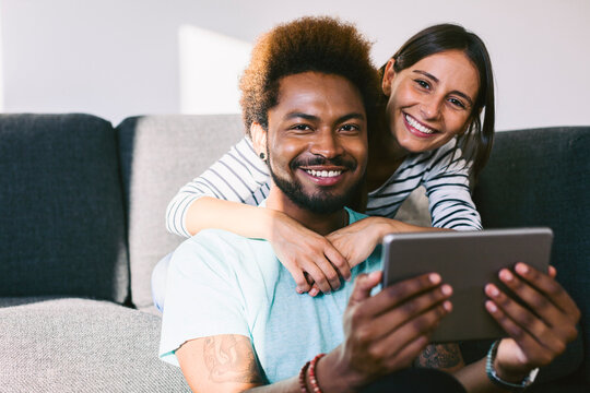 Young couple using digital tablet
