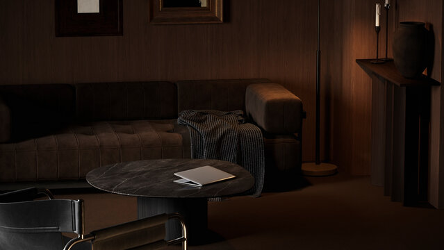 A modern laptop sits on a marble table in a dark brown living room