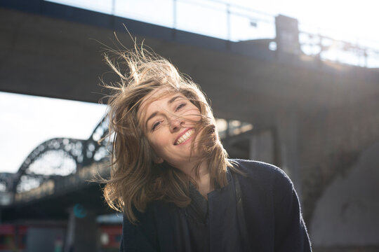 Portrait of happy woman with blowing hair