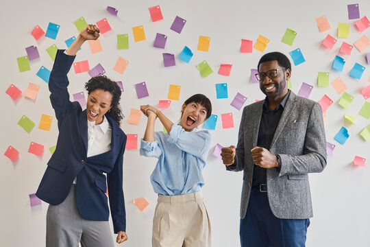 Colleagues celebrate business success at the office in London