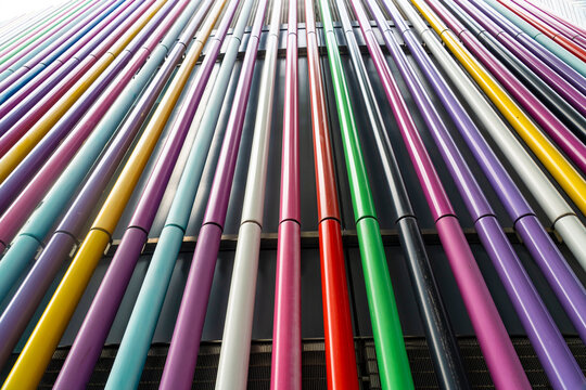 Colorful modern metal pipes on a building facade in Liverpool