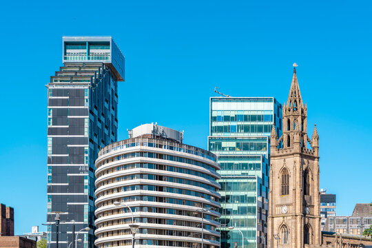 Modern skyscrapers and historic church in Liverpool city center