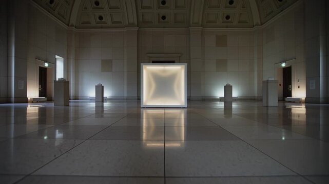 Timed lights causing lit cube art shifting star-square forms in hall on display, floor glow