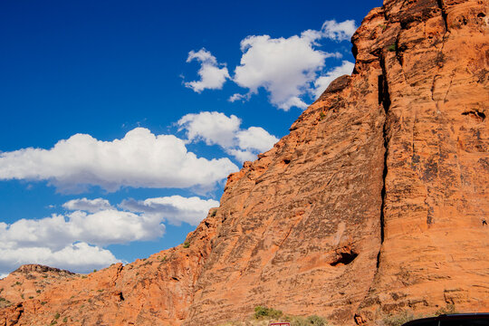 Red rock cliffs under blue sky at red Cliffs Desert State Park