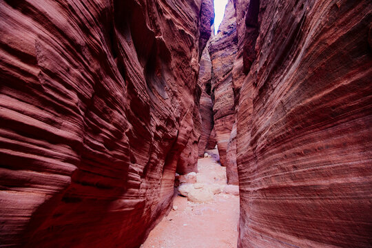 Slot canyon with narrow red sandstone walls in buckskin gulch Utah