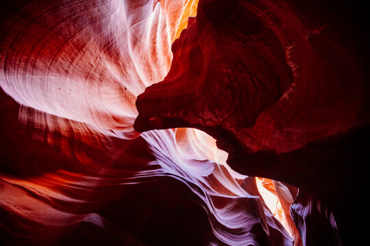 Curved sandstone formations illuminated by light