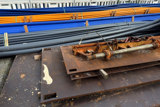 Color pipes and metal scraps on a construction site during the day