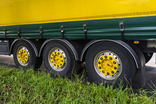 Truck parked by the roadside with visible wheels and tires