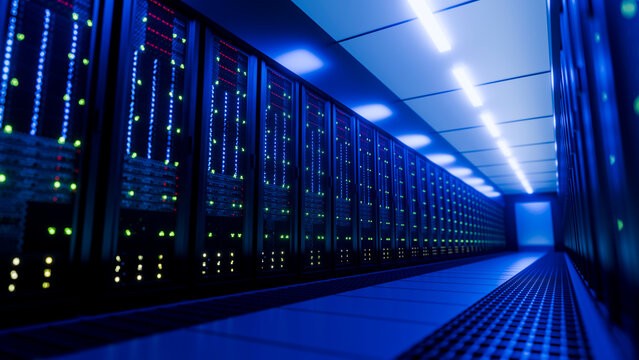 Server racks with numerous led status lights in data center hallway