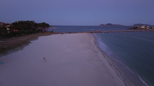 Sunrise over O Vao Beach in Vigo with Toralla Bridge and C&iacute;es Islands