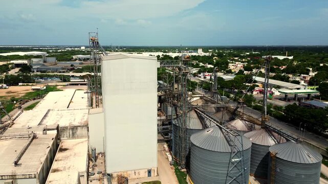Aerial view of industrial grain elevator and silo storage tanks