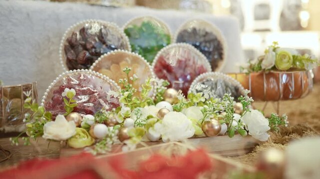 Luxury decorated dry fruits and sweets gift hamper trays with floral arrangement for Indian wedding