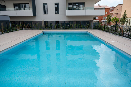 Swimming pool with modern apartment building and urban living
