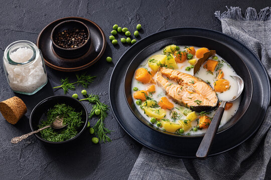 Nordic style creamy fish soup with a salmon steak