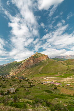 The grassy slopes and rocky summits of the Caucasus Mountains in Chegem Gorge