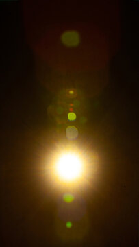 Sun flare on the black background