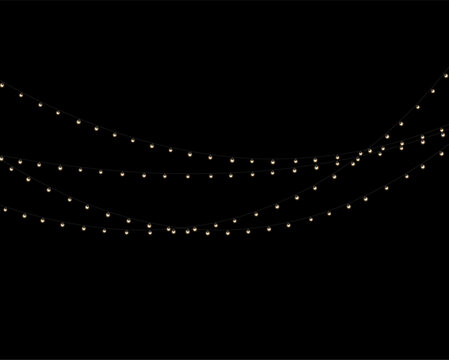 String lights create a cozy ambient glow against a black background. The warm bulbs are evenly spaced along thin, gently curving wires. This setup is perfect for festive or intimate evening.