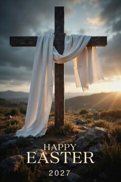 Wooden cross draped with white fabric standing on a rocky hill at sunset, happy easter 2027 text
