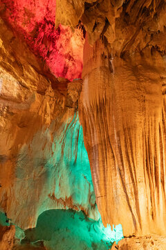 Colorful rock formations inside a cave with varied lighting in the United States