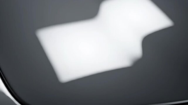 Abstract reflection of white light sources on a dark surface