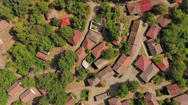 Aerial view of old rustic vintage houses with wine cellars in Rogljevacke pivnice in Negotin region of Serbia, 4k