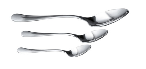 Obraz premium Different sizes of silver spoons arranged in a row on a plain background