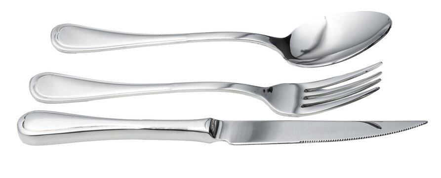 Set of silver cutlery placed on a white background with spoon, fork, and knife arranged in a row