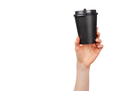 Hand holding a black coffee cup against a white background during a casual moment