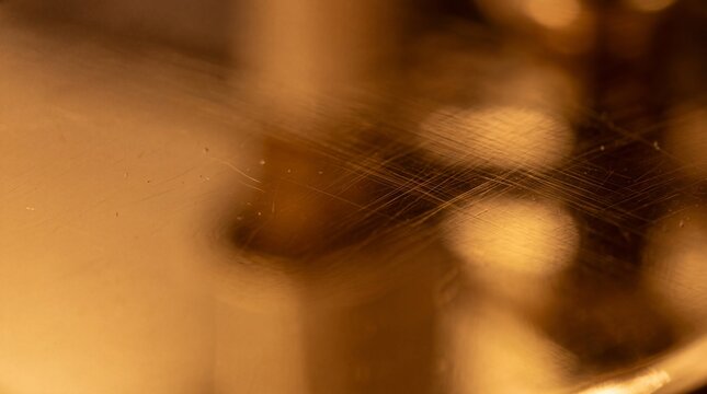 Macro Scratched Golden Metallic Surface with Bokeh