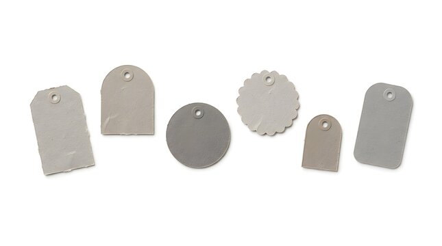 Set of grey gift tags with different shapes and textures for retail branding decoration.