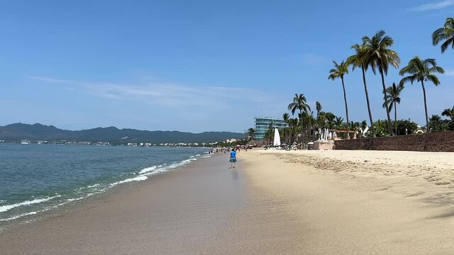 Point-of-view shot of a tourist walking along a beautiful beach in Nuevo Nayarit.