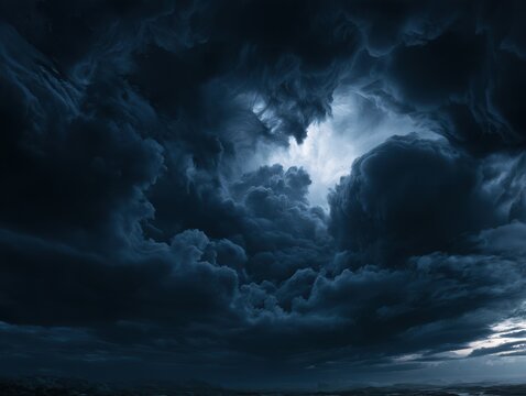 Dramatic dark storm clouds with moonlight breaking through