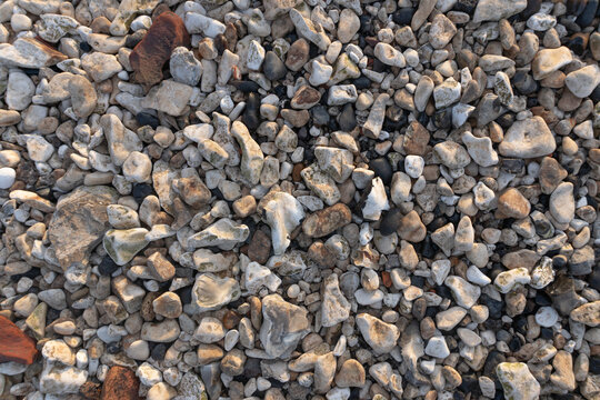 Close-up of natural river pebbles and flint stones on a beach