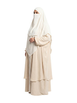 Full Length Muslim Woman in Off White Abaya and White Niqab Isolated on Black Background   
