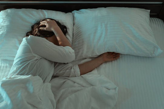 poor sleep, nightmare, woman sleeping in bed and having bad dreams, anxiety and stress, depression, loneliness
