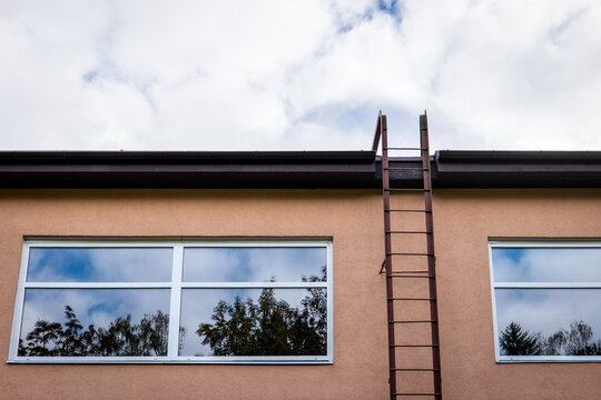 Fixed Metal Access Ladder Leading to a Building Rooftop